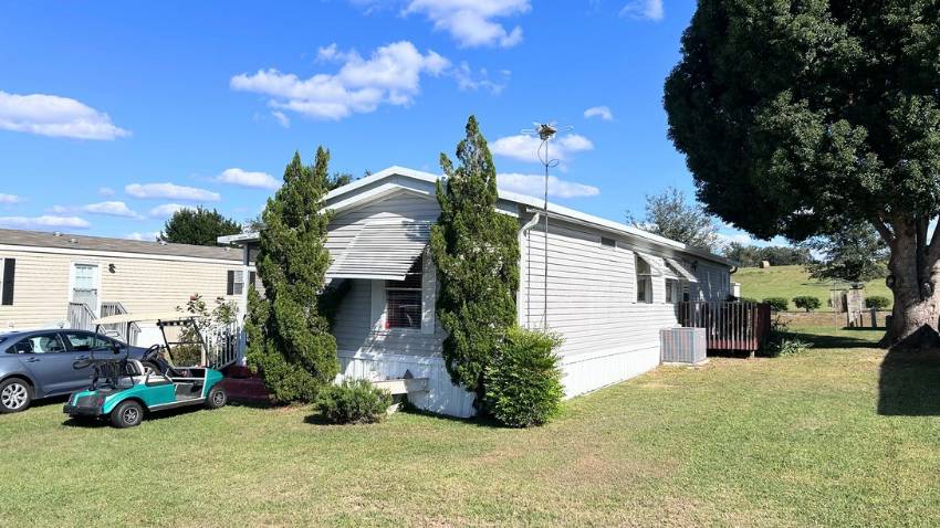 Weirsdale, FL Mobile Home for Sale located at 12701 Se Sunset Harbor Rd. Big Lake Village